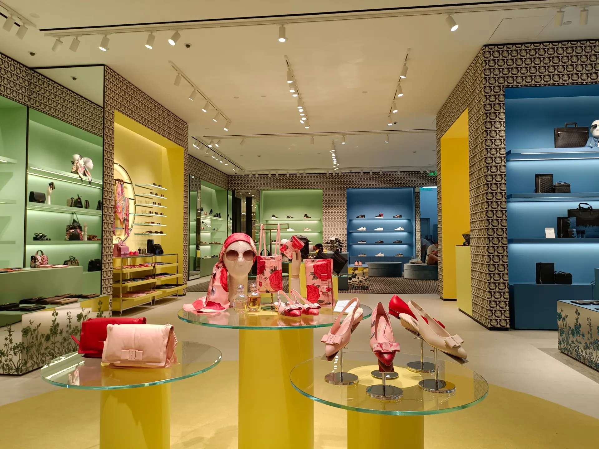 Luxury retail store illuminated with architectural track lighting for premium product displays