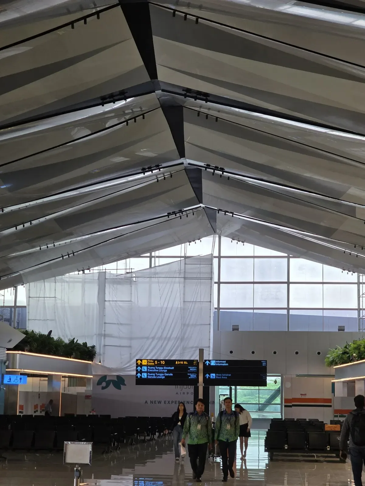 Airport terminal lighting design with uniform illumination and architectural linear lighting