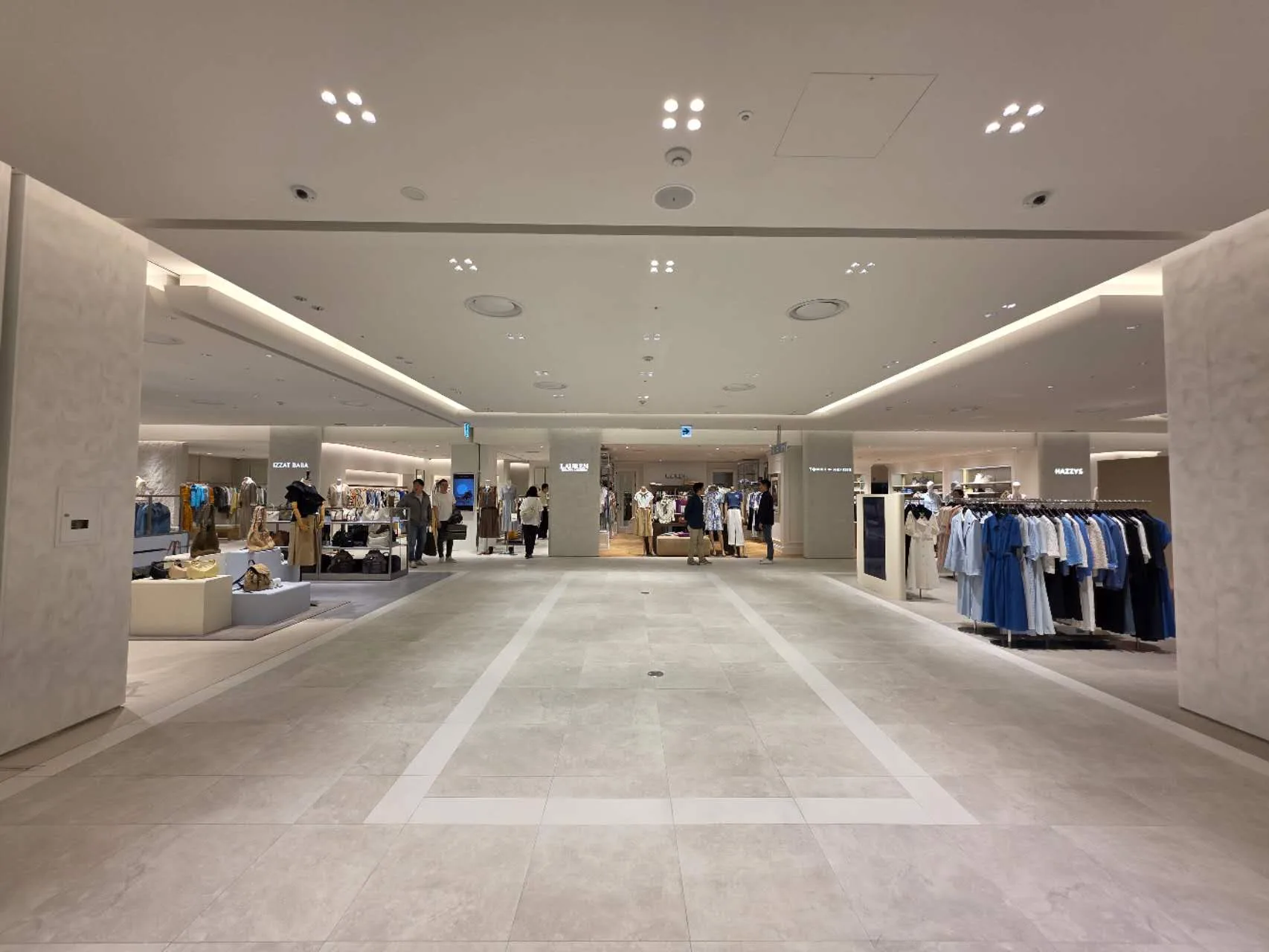 Lifestyle retail display featuring EMMA Track Lights highlighting premium home products.