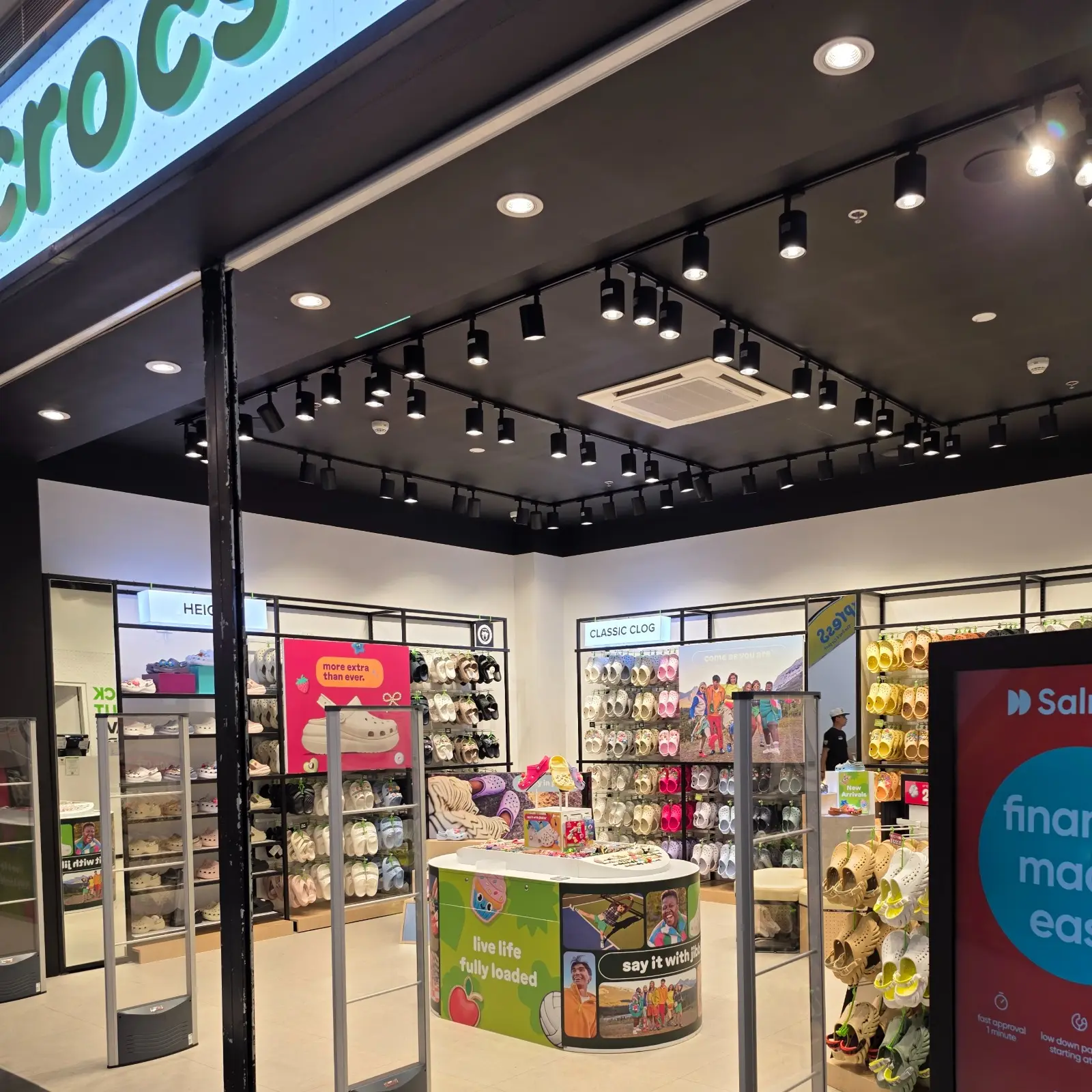 Retail display area featuring flexible track lighting and SLIM downlights.