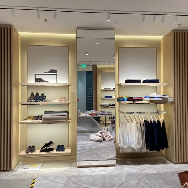 Luxury apparel display illuminated with cabinet lighting.