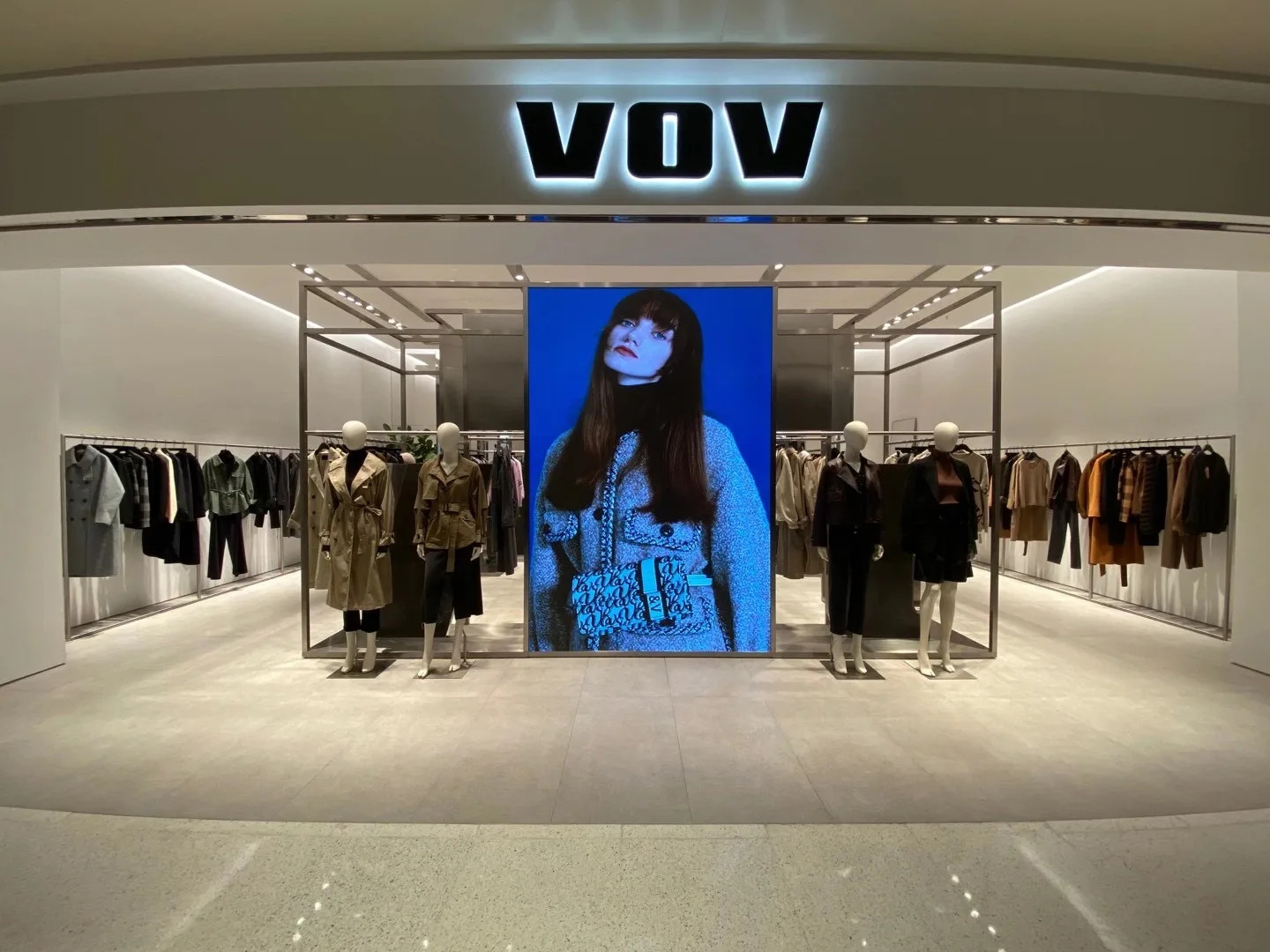 Retail apparel display illuminated by ARMI track lights and FLEXI recessed downlights.