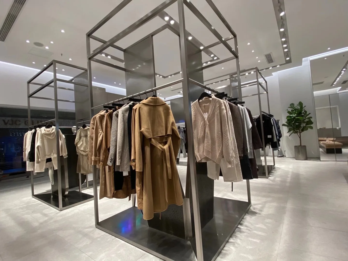 Front entrance of VOV fashion store with architectural retail lighting.