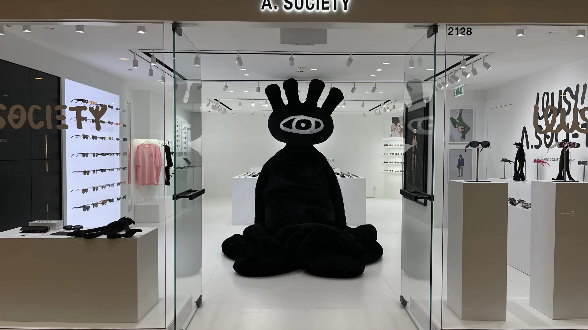 Entrance of A. SOCIETY retail store featuring BEAMX track lights and VOLI recessed downlights.