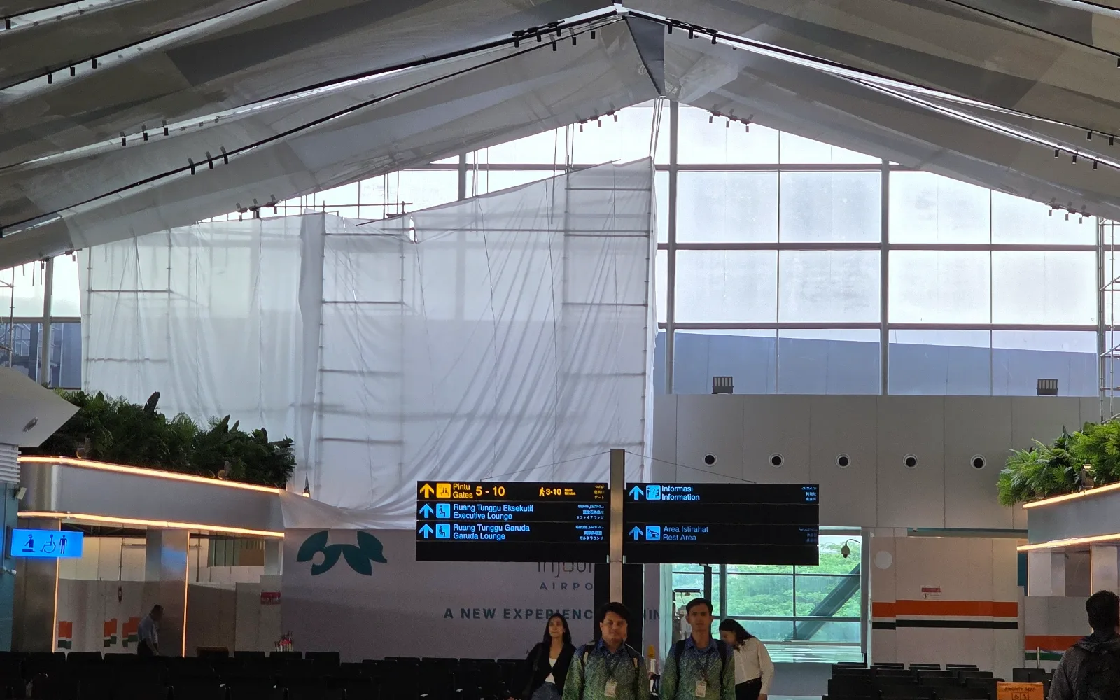 Airport terminal ceiling with EMMA Track Lights integrated into the architectural structure.
