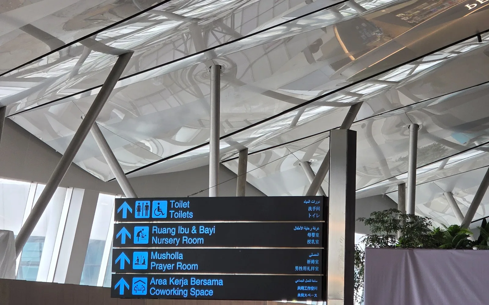 Architectural ceiling featuring EMMA Track Lights installed along the terminal roof structure at Jakarta International Airport.